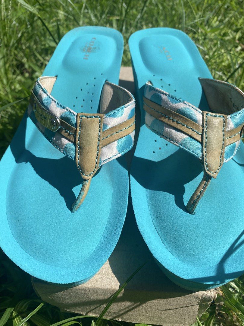 Coach Jaden Blue Wedge Flip Flops Sandals (Category: Wedges) located in Naga. Submitted by foryouandhercloset (Listing ID 1468717700, Image 2). Description: Size 7-8 24 cm Very good condition with signs of usage - Brand: Coach - Style: Wedge flip flops in bright blue - Straps: White and blue polka dot pattern with tan leather trim and metal Coach logo plaque - Footbed: Perforated with stamped Coach logo at the heel - Outsole: Rubber with signatur