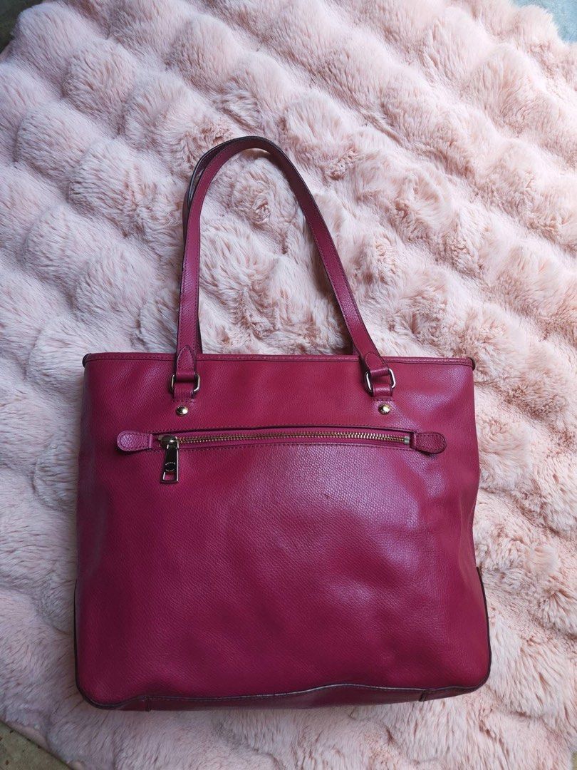 Coach Leather Tote Bag Pink (Category: Luxury Bags & Wallets) located in Manila. Submitted by jeromskito66462 (Listing ID 1468883677, Image 2). Description: - Brand: Coach - Material: Genuine leather in bright pink - Hardware: Gold-tone - Closure: Zip top - Straps: Double shoulder straps - Exterior: Front zip pocket and hanging leather tag - Interior: Fabric-lined with a secure inside zip compartment - Design: Structured shape, ideal everyday siz