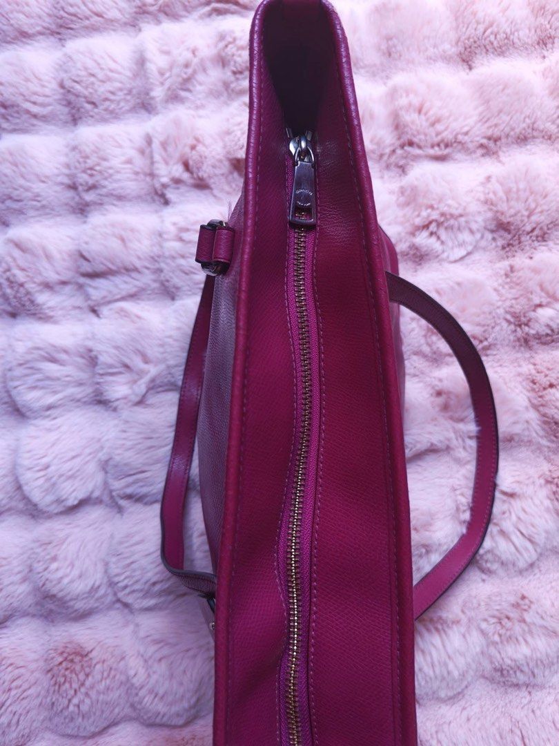Coach Leather Tote Bag Pink (Category: Luxury Bags & Wallets) located in Manila. Submitted by jeromskito66462 (Listing ID 1468883677, Image 3). Description: - Brand: Coach - Material: Genuine leather in bright pink - Hardware: Gold-tone - Closure: Zip top - Straps: Double shoulder straps - Exterior: Front zip pocket and hanging leather tag - Interior: Fabric-lined with a secure inside zip compartment - Design: Structured shape, ideal everyday siz