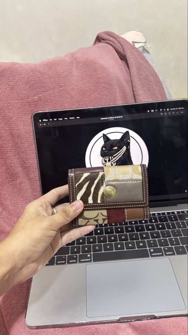 Coach Patchwork Multi-pattern Trifold Wallet (Category: Wallets & Card holders) located in Manila. Submitted by ryuuu_vv (Listing ID 1468834902, Image 1). Description: - Brand: Coach - Style: Trifold wallet with gold-tone snap button closure and Coach engraving - Material/Design: Unique patchwork mix including zebra print pony hair, signature monogram canvas, metallic gold leather, brown leather, and red suede - Size: Compact - Condition: Clean a