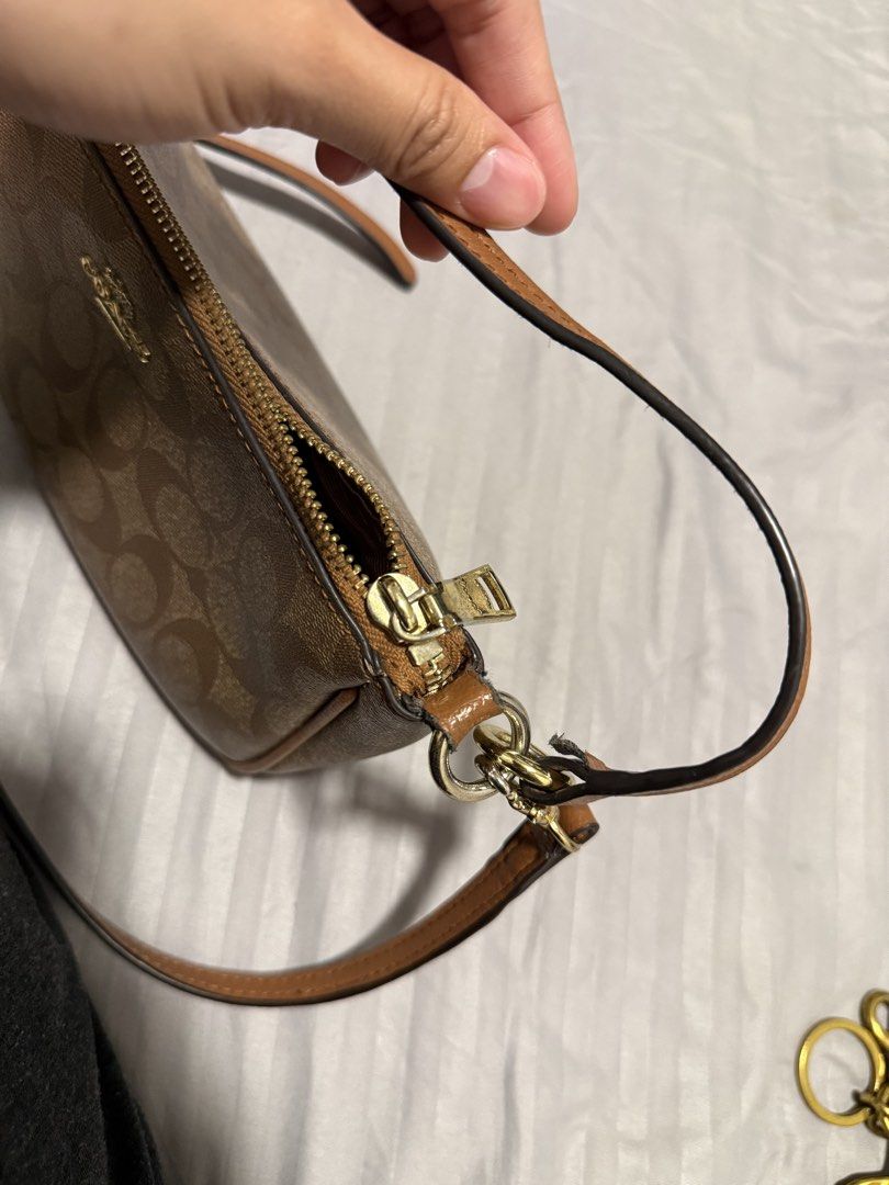 COACH Shoulder/Sling Bag (Category: Cross-body Bags) located in Manila. Submitted by karizetto (Listing ID 1468866865, Image 3). Description: NGA check pics thoroughly with free CHERRY KEYCHAIN hindi na maalis yung amoy storage/cabinet ng bag .