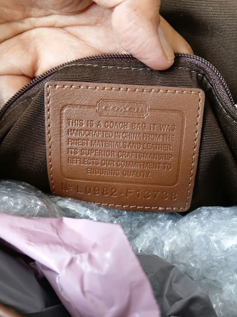 Coach Soho Pleated Shoulder Bag (Category: Luxury Bags & Wallets) located in Paete. Submitted by glamluxxereloved (Listing ID 1468751584, Image 2). Description: Rank A no issue, minimal to unnoticeable sign of usage,super prettyyyyy, Price is negotiable - Authentic brown Coach shoulder bag in signature C monogram fabric - Premium leather trim and adjustable buckle strap - Secure silver hardware snap closure on the front flap - Includes a classic 