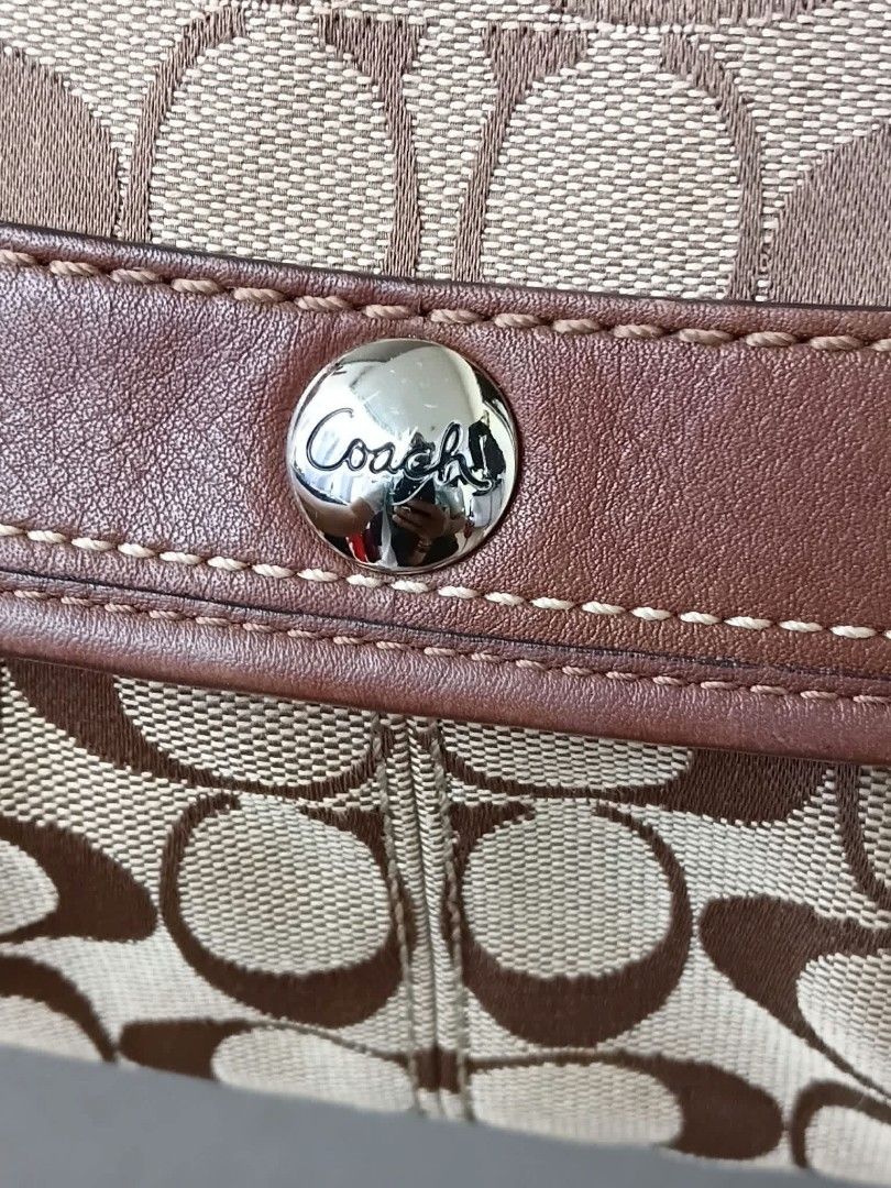 Coach Soho Pleated Shoulder Bag (Category: Luxury Bags & Wallets) located in Paete. Submitted by glamluxxereloved (Listing ID 1468751584, Image 3). Description: Rank A no issue, minimal to unnoticeable sign of usage,super prettyyyyy, Price is negotiable - Authentic brown Coach shoulder bag in signature C monogram fabric - Premium leather trim and adjustable buckle strap - Secure silver hardware snap closure on the front flap - Includes a classic 
