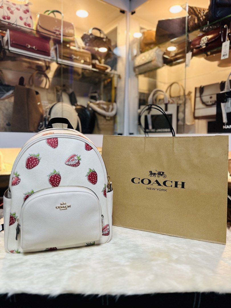 Coach Strawberry Court Backpack White Chalk Multi (Category: Backpacks) located in Porac. Submitted by bagitupshopph (Listing ID 1468712703, Image 1). Description: 💯 Authentic from USA 🇺🇸 - Brand new with original tag attached ($449 retail price) - Authentic Coach Court Backpack in Chalk White with cute strawberry print - Features elegant gold-tone hardware, front zip pocket, and top zip closure - Comfortable black mesh padded back panel with 