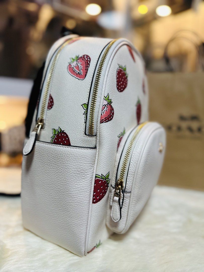 Coach Strawberry Court Backpack White Chalk Multi (Category: Backpacks) located in Porac. Submitted by bagitupshopph (Listing ID 1468712703, Image 3). Description: 💯 Authentic from USA 🇺🇸 - Brand new with original tag attached ($449 retail price) - Authentic Coach Court Backpack in Chalk White with cute strawberry print - Features elegant gold-tone hardware, front zip pocket, and top zip closure - Comfortable black mesh padded back panel with 