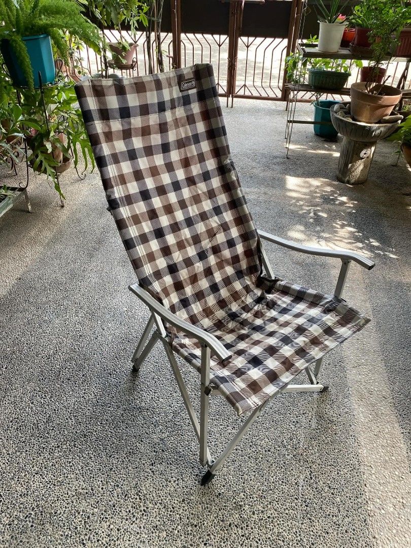 Coleman Brown Plaid Folding Camping Chair (Category: Hiking & Camping) located in Quezon City. Submitted by maxsab (Listing ID 1468882100, Image 1). Description: - Brand: Coleman - Design: Brown and beige plaid pattern with iconic logo on the back - Comfort & Support: High back design with stylish wood-look armrests - Build: Sturdy metal frame for reliable durability - Portability: Folds up easily for hassle-free storage and transport - Best For:
