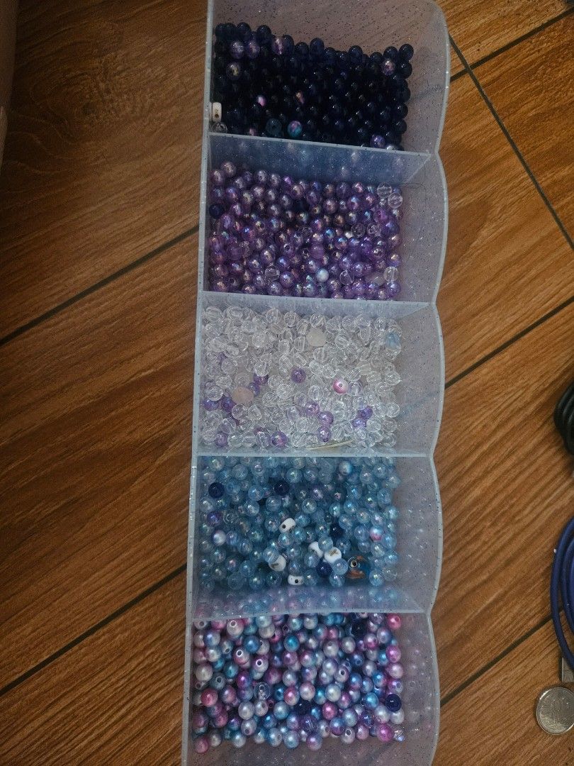 Colorful craft beads (Category: Craft Supplies & Tools) located in Valenzuela. Submitted by marionroseee (Listing ID 1468731519, Image 1). Description: - take all - small round beads, bought too many or the taylor swift concert before - Colors: Deep navy, purple, clear, light blue, and iridescent pink-blue mix - Use for DIY jewelry making, friendship bracelets, and crafts .