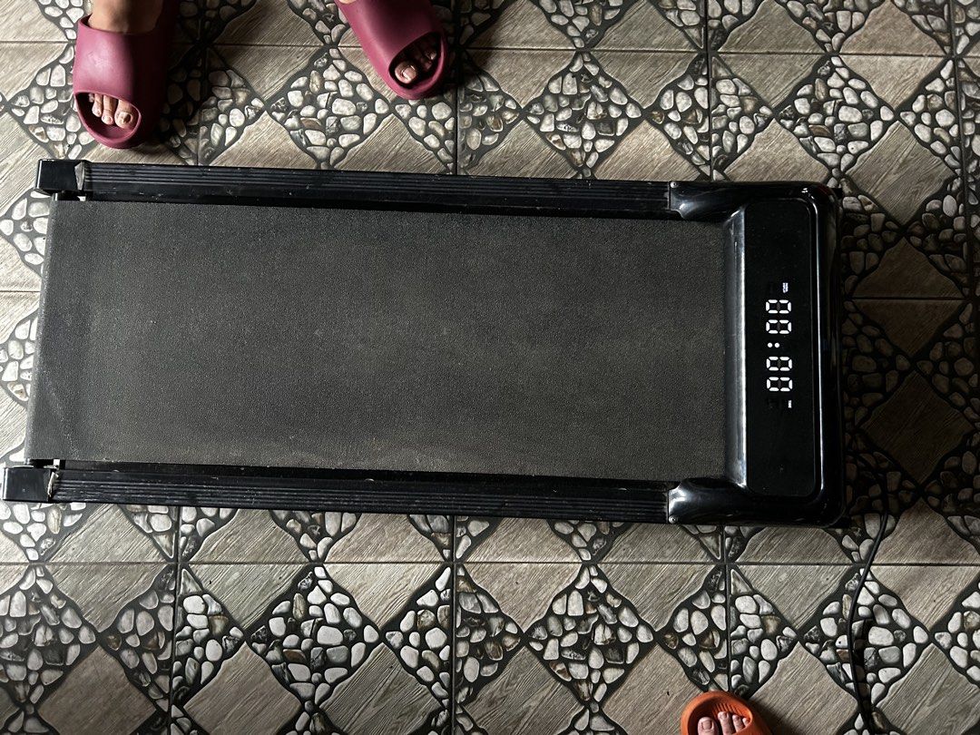 Compact Under Desk Walking Pad Treadmill with Remote (Category: Cardio & Fitness Machines) located in Bulacan. Submitted by jseongcart_ (Listing ID 1468808387, Image 3). Description: Conditions: - Can hold up to 150kg weight - Used x3 only - Rfs: decluttering ----------- - Type: Compact walking pad treadmill - Color: Sleek black - Condition: Tested and working properly - Features: Digital display (tracks speed and distance) and handheld remote co