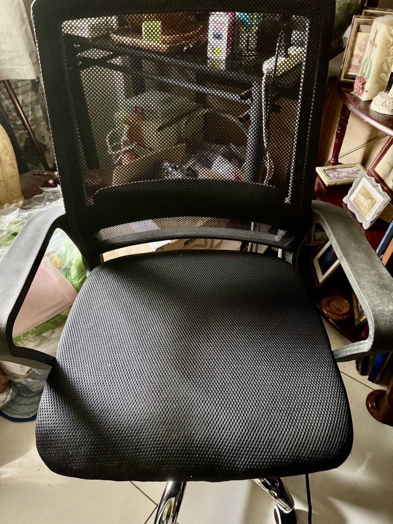 Computer Chair (swivel) with Armrests (Category: Office Furniture & Fixtures) located in Manila. Submitted by clarovida888 (Listing ID 1468742842, Image 1). Description: - Color: Black - Material: Breathable mesh backrest and seat - Support: Sturdy armrests on both sides - Mobility: Smooth-rolling wheels on a chrome base - Function: Fully working adjustable height mechanism - Condition: Clean, well-maintained, and ready for immediate use Reason f