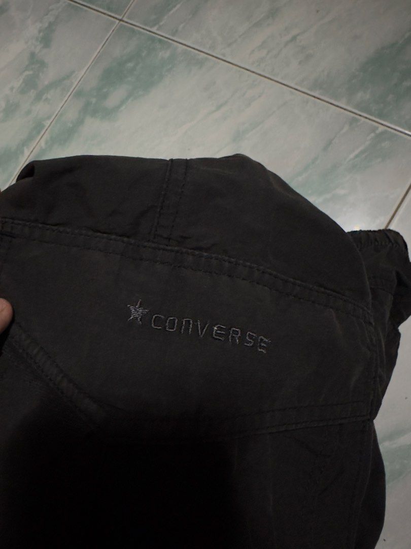 Converse Convertible Pants (Category: Activewear) located in Manila. Submitted by youngvill (Listing ID 1468797527, Image 3). Description: - Color: Washed black - Closure: Button waist - Pockets: Secure zippered side pockets - Condition: Clean, no major flaws - Ideal for: streetwear outfits.