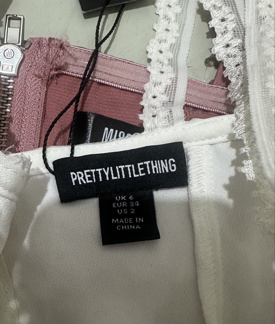 Corset Top bundle (Missguided + prettylittething + zara) (Category: Sleeveless) located in Zamboanga. Submitted by thriftie.zam (Listing ID 1468840527, Image 3). Description: - Bundle of 3 trendy crop tops - Size: UK 6, EUR 34, US 2 (Extra Small) - Includes: * White textured piece with delicate lace straps (with boning) (prettylittlething) * Dusty pink satin corset top with front zipper (missguided) (never used) * Olive green draped style (thick 