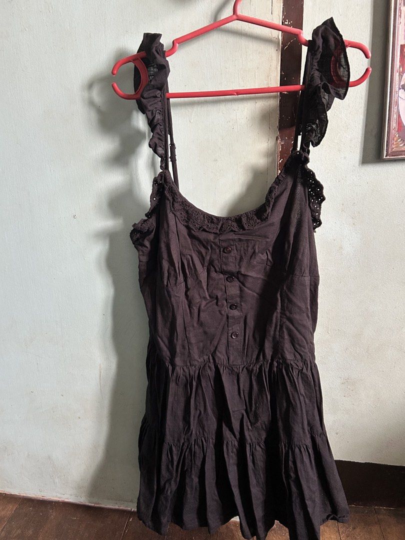 Cotton On Black Ruffle Strap Dress (Category: Dresses) located in Caloocan City. Submitted by salongarin74922 (Listing ID 1468712528, Image 1). Description: - Brand: Cotton On - Size: AU 10 / US 6 / EU 38 - Color: Black - Design: Adjustable ruffle straps, button-down front bodice, crochet lace scoop neckline, and tiered skirt silhouette - Origin: Made in India - Style Tip: Perfect warm-weather casual piece; easily pairs with sandals or sneakers.