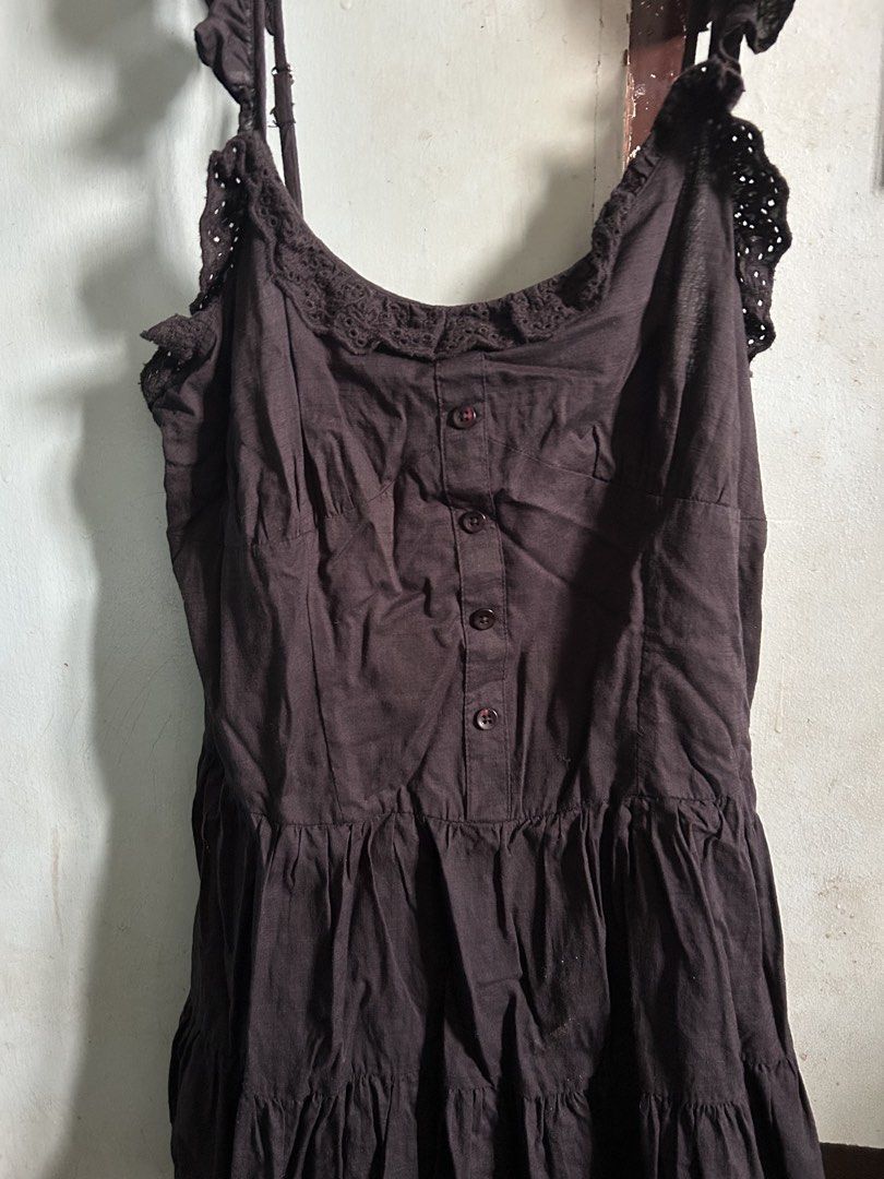Cotton On Black Ruffle Strap Dress (Category: Dresses) located in Caloocan City. Submitted by salongarin74922 (Listing ID 1468712528, Image 2). Description: - Brand: Cotton On - Size: AU 10 / US 6 / EU 38 - Color: Black - Design: Adjustable ruffle straps, button-down front bodice, crochet lace scoop neckline, and tiered skirt silhouette - Origin: Made in India - Style Tip: Perfect warm-weather casual piece; easily pairs with sandals or sneakers.