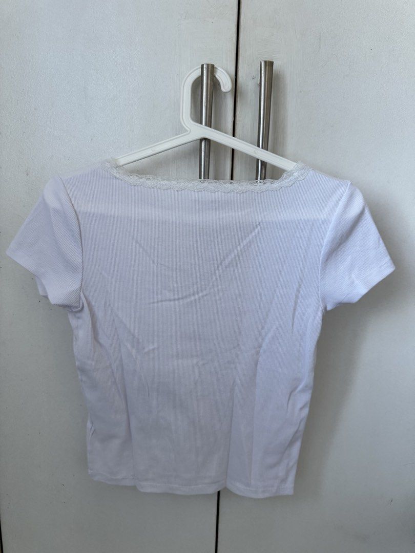 Cotton On White Lace Trim Tee Size M (Category: Shirts) located in Manila. Submitted by secondguess (Listing ID 1468842233, Image 2). Description: - Brand: Cotton On - Size: M (tag intact) - Color: Crisp White - Material: Comfortable ribbed cotton - Details: V-neckline and front seams with delicate lace trim - Condition: Clean and well-maintained - Style: Versatile basic, easy to pair with jeans or skirts RFS: only used ONCE 🥲 not my style anymo
