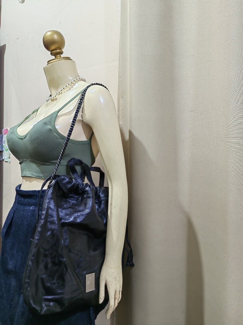 Couronne Black Leather Drawstring Bucket Bag (Category: Cross-body Bags) located in Makati City. Submitted by prelovedtreatedwithlove (Listing ID 1468893400, Image 1). Description: - Brand: Couronne - Material: Soft, black leather - Closure: Secure drawstring top with a gathered look - Style : 2 way with YKk zip - Condition : Excellent A-174.