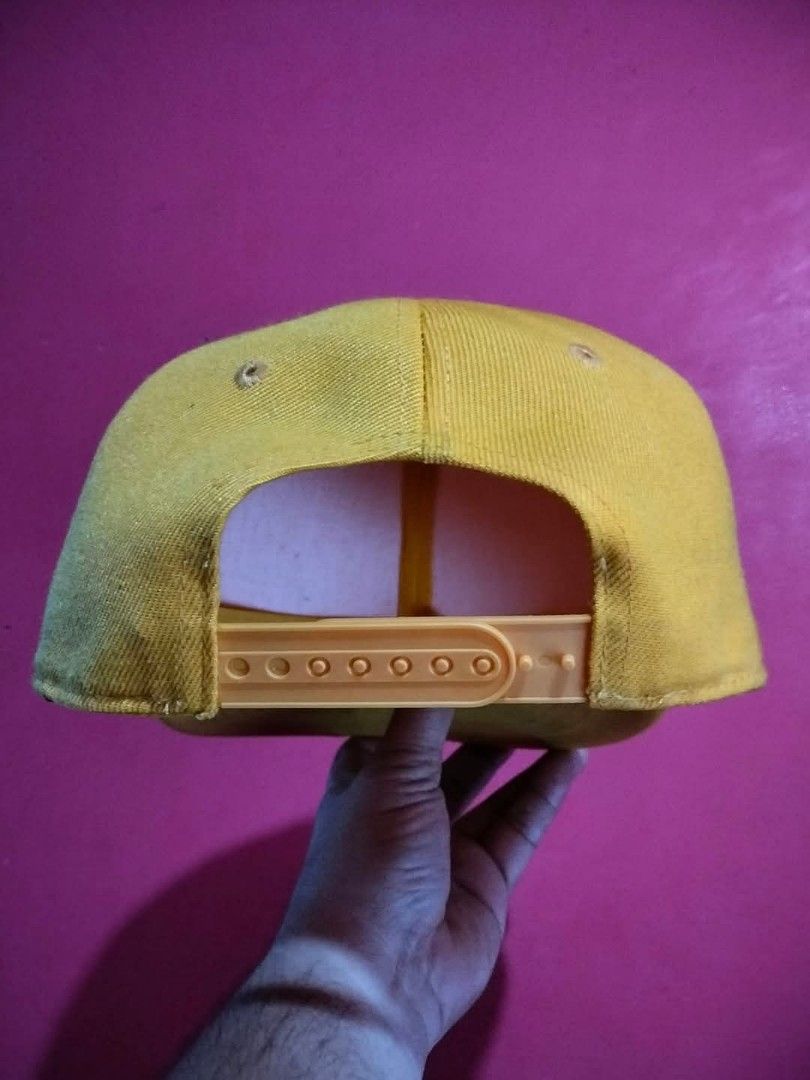 CoXist Yellow Snapback Cap (Category: Caps & Hats) located in Mangaldan. Submitted by niftythrifty69 (Listing ID 1468729661, Image 2). Description: - Brand: CoXist - Color: Solid yellow - Style: Classic snapback with flat brim and adjustable fit - Material: 100% polyester - Size: One size fits all - Care: Hand wash only.