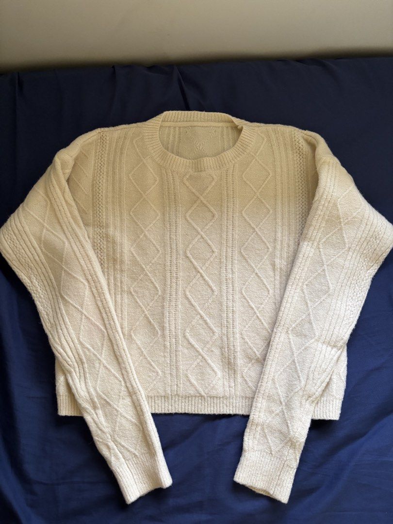Cream Cable Knit Cropped Crewneck Sweater (Category: Coats, Jackets and Outerwear) located in Manila. Submitted by prelovedbykleng (Listing ID 1468850816, Image 1). Description: Fits S-L - Color: Cream - Style: Cropped cable knit sweater with relaxed fit - Details: Intricate diamond pattern on front and sleeves, ribbed crewneck, cuffs, and hem - Material: Soft, warm, and cozy knit - Condition: Clean, no flaws spotted - Best for: Cool weather laye