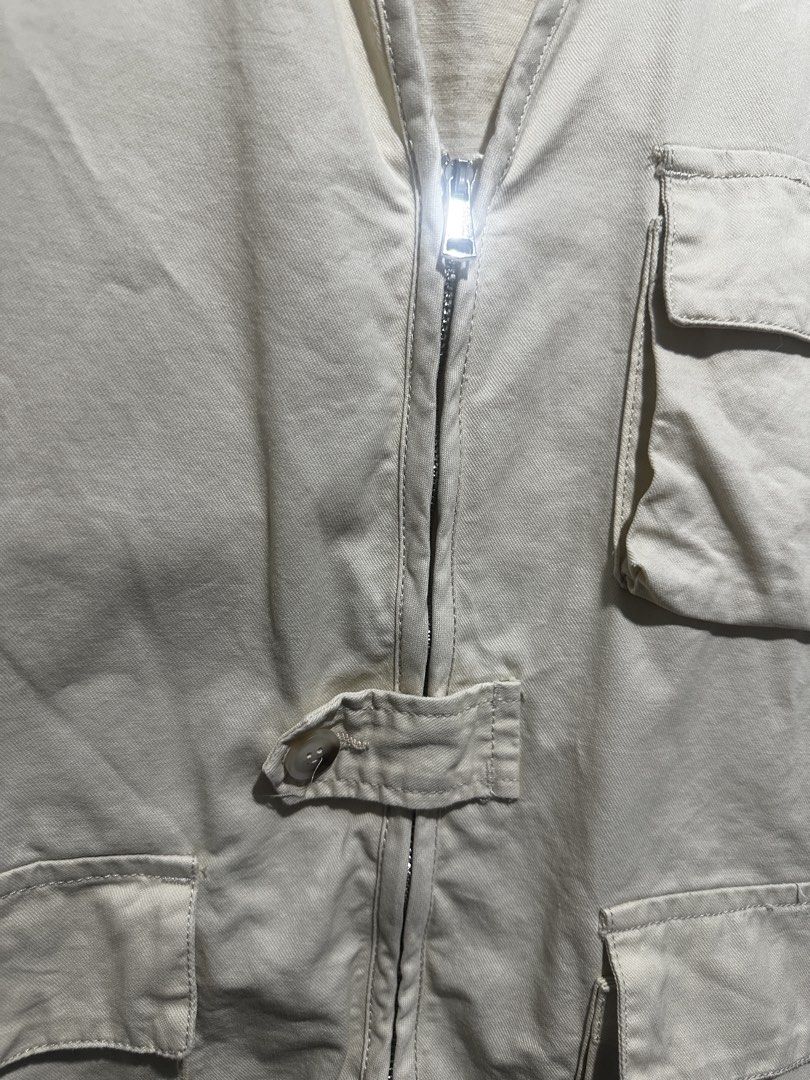 Cream Utility Vest with Multiple Pockets and Zipper (Category: Vests) located in Quezon City. Submitted by tryvestz (Listing ID 1468801370, Image 3). Description: Can fit medium to large Cream utility vest in a relaxed fit. Features a full front zipper, button tab detail, and four large front pockets. Sleeveless and versatile, perfect for layering over tees or hoodies..