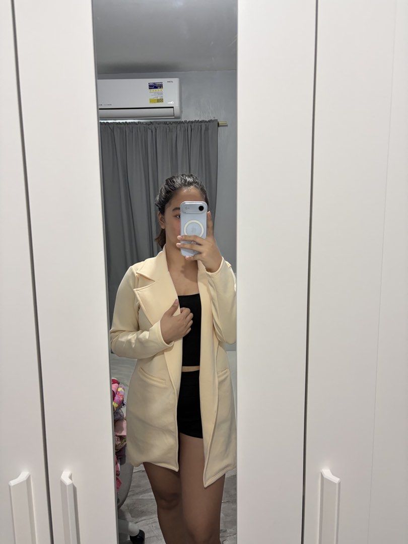 Cream Yellow Open Front Long Blazer Jacket (Category: Coats, Jackets and Outerwear) located in Bulacan. Submitted by lenggayy (Listing ID 1468801152, Image 1). Description: - Color: Cream yellow - Style: Long blazer with open front and lapels - Features: Two functional front pockets, smooth and nice-draping fabric - Condition: Worn a few times, no stains or damage - Best for: Layering to instantly dress up any simple outfit.