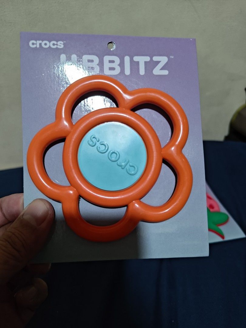 Crocs Jibbitz Mega Orange and Blue Flower & Mega Strawberry (Category: Slippers and slides) located in Valenzuela. Submitted by wisewhale_46982b (Listing ID 1468773209, Image 2). Description: - Official Crocs merchandise: Authentic Jibbitz charms - Set of 2 oversized designs: Mega blue/orange flower and mega pink/green strawberry - Brand new: Still attached to original purple packaging - Versatile: Great way to personalize and customize Crocs clo
