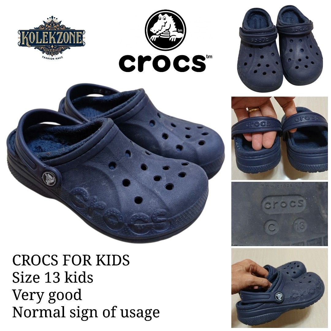 Crocs Kids Lined Clogs Navy Size 13 (Category: Babies & Kids Fashion) located in Nasugbu. Submitted by staffpicks1515 (Listing ID 1468792932, Image 1). Description: - Size: Kids 13 - Color: Navy Blue - Features: Warm fuzzy lining for cozy comfort, classic ventilation holes, and versatile heel strap - Condition: Normal signs of use on soles and uppers, but still has lots of life left - Perfect for colder days!.