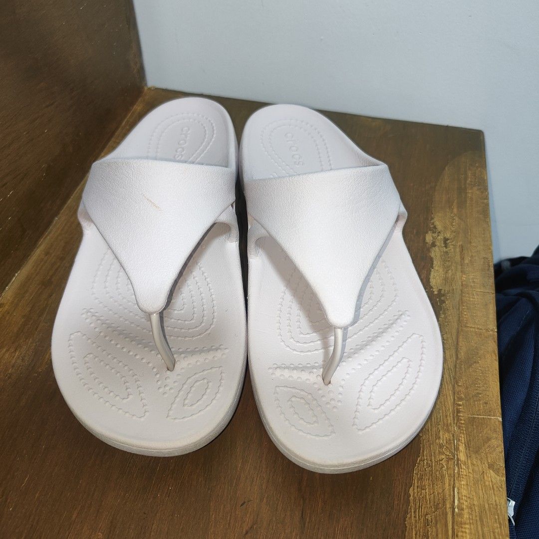 Crocs slippers (Category: Slippers and slides) located in Baguio. Submitted by virtualgarage.sale (Listing ID 1468892873, Image 3). Description: Please read Preloved authentic crocs. Size 8 women's Has a pinkish color 400 pesos .