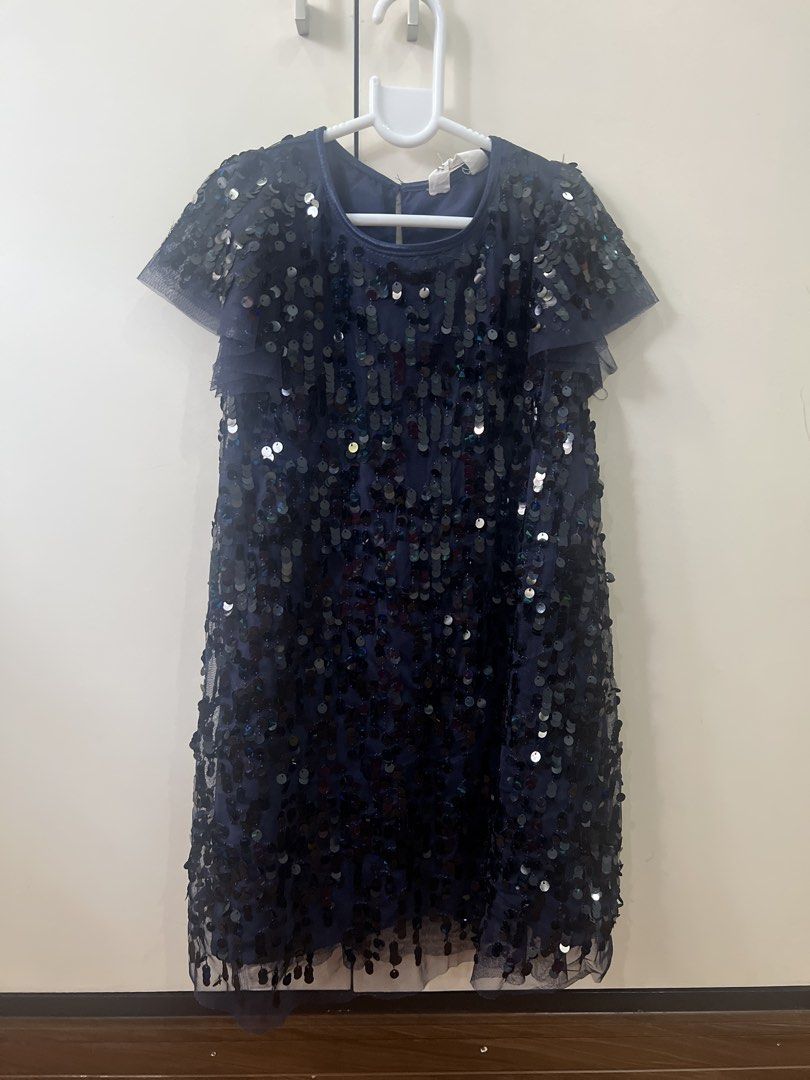 Kids Sequin Dress (Category: Babies & Kids Fashion) located in Quezon City. Submitted by Bargain_FindsPH (Listing ID 1468725608, Image 1). Description: - Color: Dark blue - Fully covered in sparkling sequins from top to bottom - Cute short ruffled mesh sleeves and classic round neckline - Knee-length with a stylish sheer hem layer - Fully lined interior for a comfortable fit - Features a convenient small back closure - Fits 5-6yo.