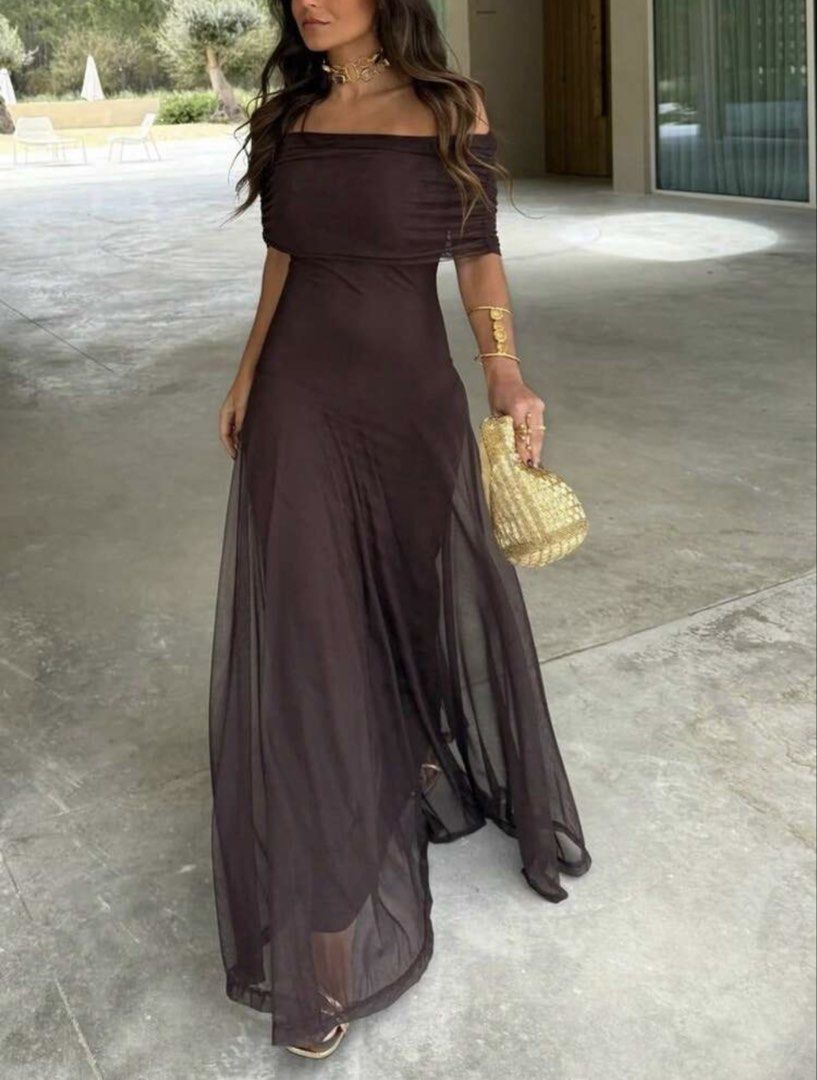 Dark Brown Off-Shoulder Draped Maxi Dress (Category: Dresses) located in Mandaluyong City. Submitted by rizmariecruz92152 (Listing ID 1468914498, Image 1). Description: - Color: Dark Brown - Style: Off-shoulder neckline with elegant draped overlay - Fit: Fitted bodice with a flowy maxi skirt and floor-length hem - Design: Simple pull-on style for effortless wear - Condition: Excellent, ready to wear for any occasion.