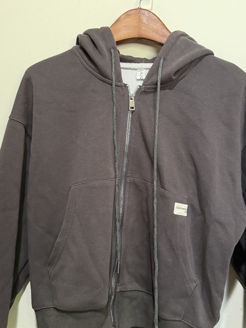 Dark Grey Zip-Up Hoodie with Front Pockets and Drawstrings (Category: Coats, Jackets and Outerwear) located in Baguio. Submitted by thelittolwardrobe (Listing ID 1468728257, Image 2). Description: S-M.