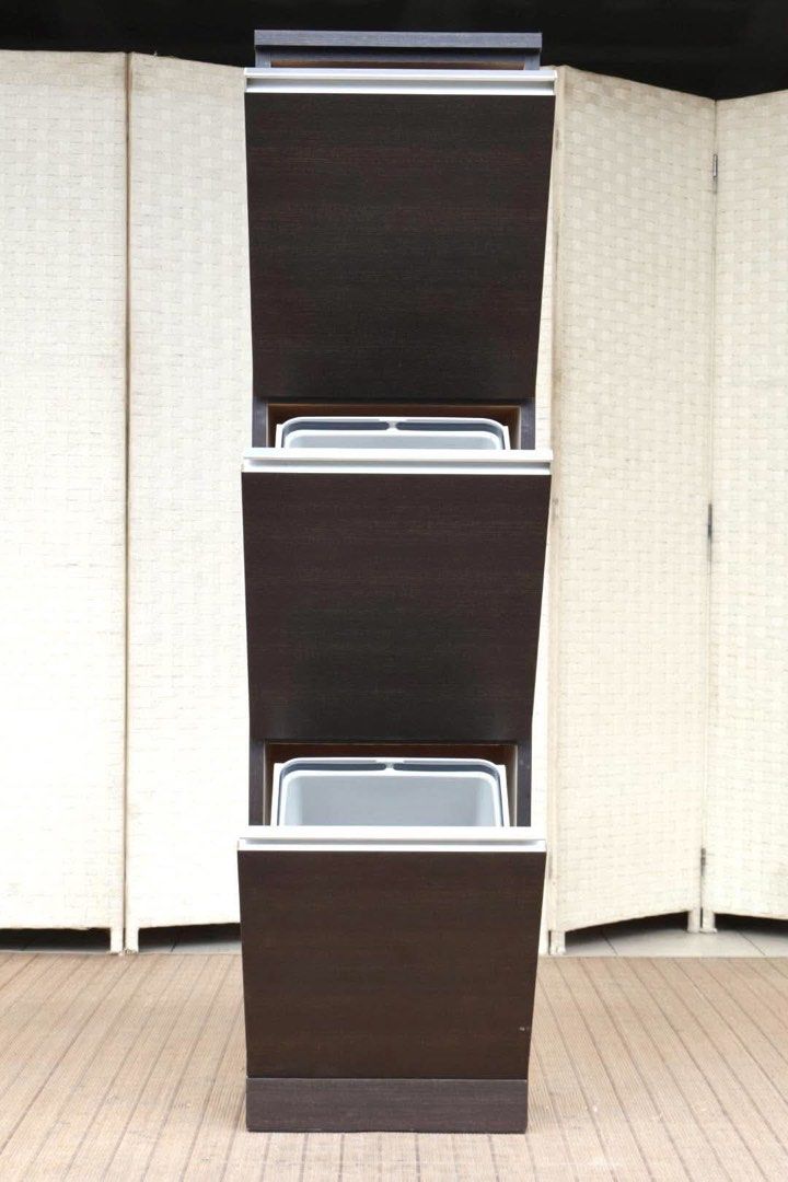 Dark wood 3-tier pull-out shoe cabinet storage rack (Category: Shelves, Cabinets & Racks) located in Manila. Submitted by justinlei.103 (Listing ID 1468806978, Image 2). Description: JAPAN SURPLUS FURNITURE SLIM TRASH BIN CABINET Size 15L x 12W x 59H in inches (AS-IS ITEM) *Minimal Scratch Only IN GOOD CONDITION.