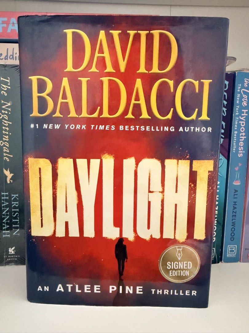 David Baldacci Daylight Signed Edition Atlee Pine Thriller (Category: Storybooks) located in Manila. Submitted by booksingshelf (Listing ID 1468762099, Image 1). Description: - Title: Daylight (Atlee Pine Series, Book 3) - Author: David Baldacci - Format: Hardcover with dust jacket - Special Feature: Gold 'Signed Edition' sticker on cover - Condition: Clean, well-maintained, stored upright on a shelf - Genre: Thriller, mystery, and suspense.