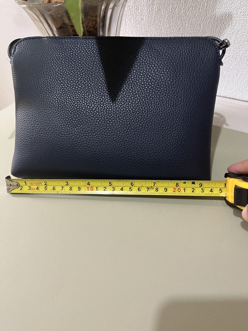 David Jones Navy Blue Crossbody Bag (Category: Cross-body Bags) located in Quezon City. Submitted by eloveshopping.ph (Listing ID 1468798209, Image 2). Description: Navy Blue David Jones Sling bag Textured faux leather with silver hardware.