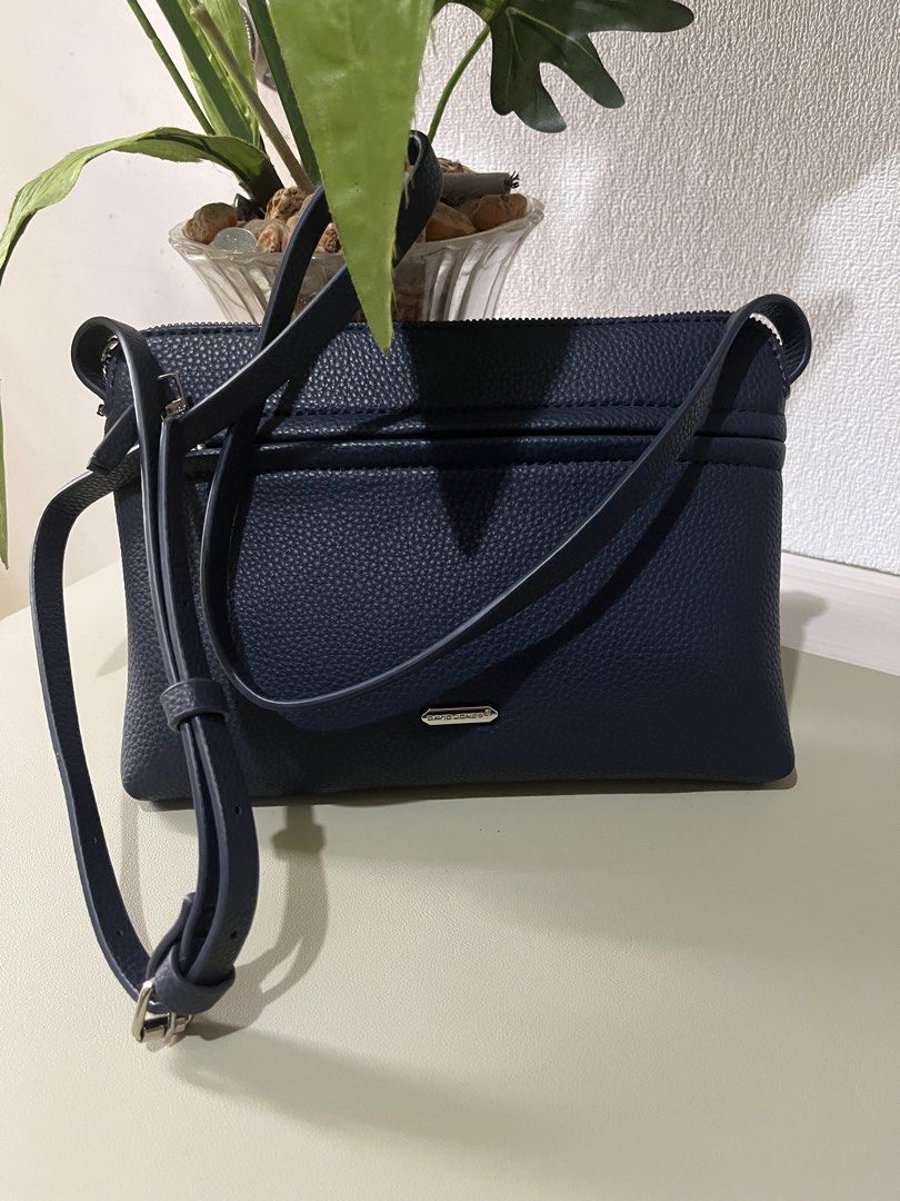 David Jones Navy Blue Crossbody Bag (Category: Cross-body Bags) located in Quezon City. Submitted by eloveshopping.ph (Listing ID 1468798209, Image 1). Description: Navy Blue David Jones Sling bag Textured faux leather with silver hardware.
