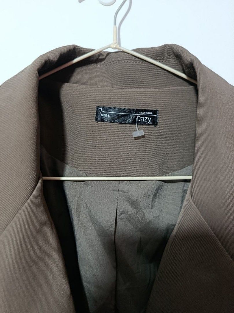 Dazy Brown Blazer Size L (Category: Coats, Jackets and Outerwear) located in Cavite. Submitted by myprelovedpicks123 (Listing ID 1468865649, Image 2). Description: - Brand: Dazy - Size: L - Color: Brown / Neutral earth tone - Features: Structured lapels, single button closure, functional side pockets - Details: Fully lined interior - Style: Great versatile layering piece for work or casual outings.