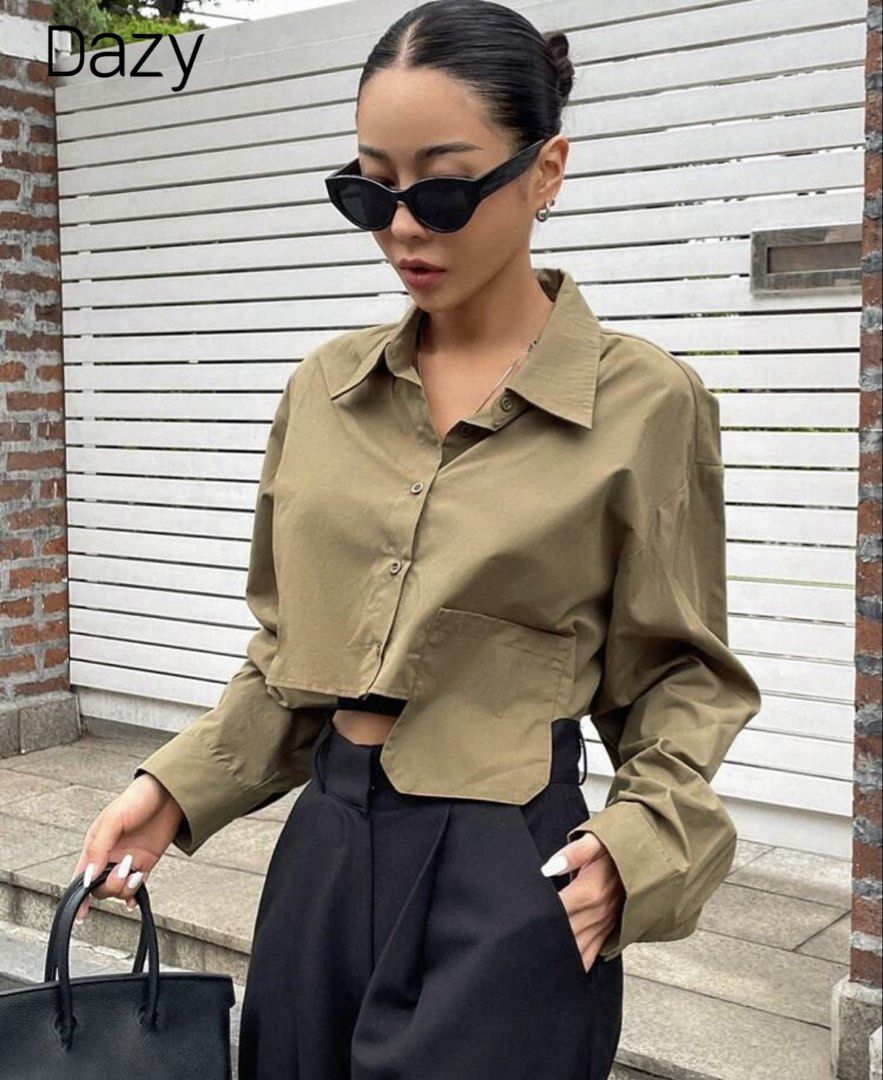 Dazy Olive Green Crop Button-Up Shirt (Category: Shirts) located in Quezon City. Submitted by a10as (Listing ID 1468884476, Image 3). Description: - Brand/Style: Dazy olive green crop button-up shirt - Material: 100% breathable and lightweight cotton - Design: Pointed collar, long sleeves with button cuffs, and front chest pocket - Fit: Trendy boxy fit with a cropped length - Styling: Perfect for layering and looks great with high-waisted pants o
