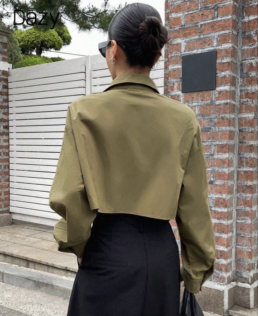 Dazy Olive Green Crop Button-Up Shirt (Category: Shirts) located in Quezon City. Submitted by a10as (Listing ID 1468884476, Image 2). Description: - Brand/Style: Dazy olive green crop button-up shirt - Material: 100% breathable and lightweight cotton - Design: Pointed collar, long sleeves with button cuffs, and front chest pocket - Fit: Trendy boxy fit with a cropped length - Styling: Perfect for layering and looks great with high-waisted pants o