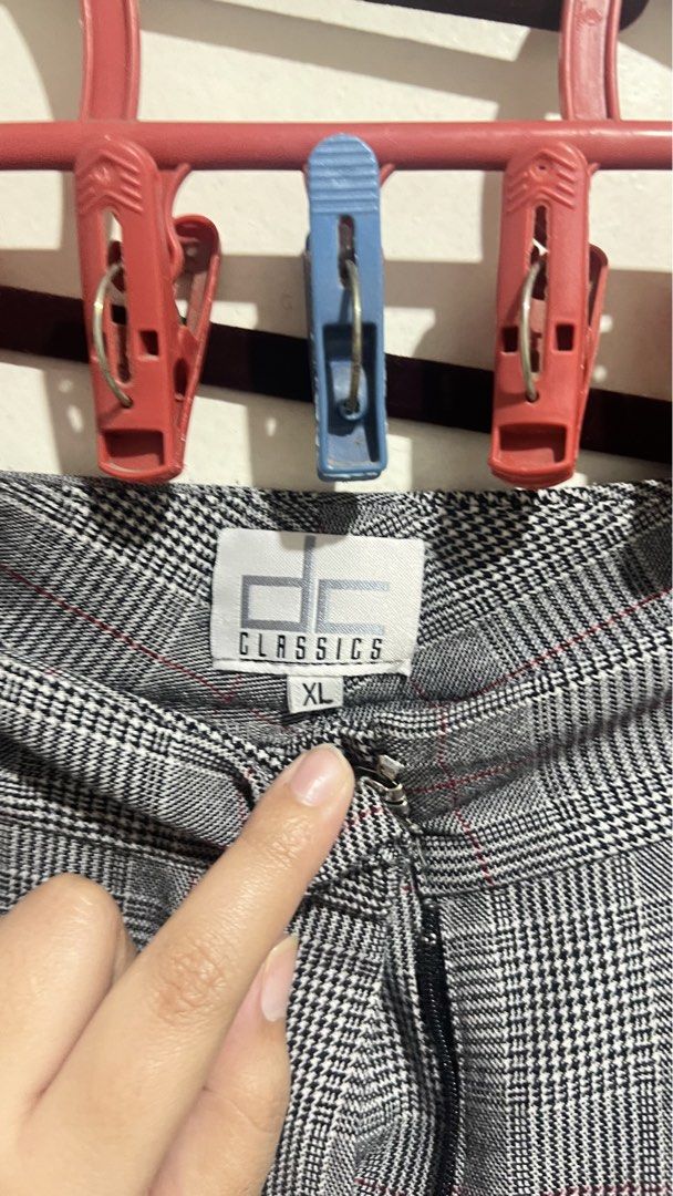 DC Classics Plaid Grey Trousers Pants Office (Category: Trousers) located in Cabuyao City. Submitted by calmstorm.0108 (Listing ID 1468835867, Image 2). Description: - Brand: DC Classics - Size: XL - Color/Pattern: Grey plaid with black, white, and subtle red grid lines - Fit: Wide leg cut with mid-rise waist - Details: Pleated front crease lines and cuffed hems - Closure: Front zipper - Condition: Excellent.