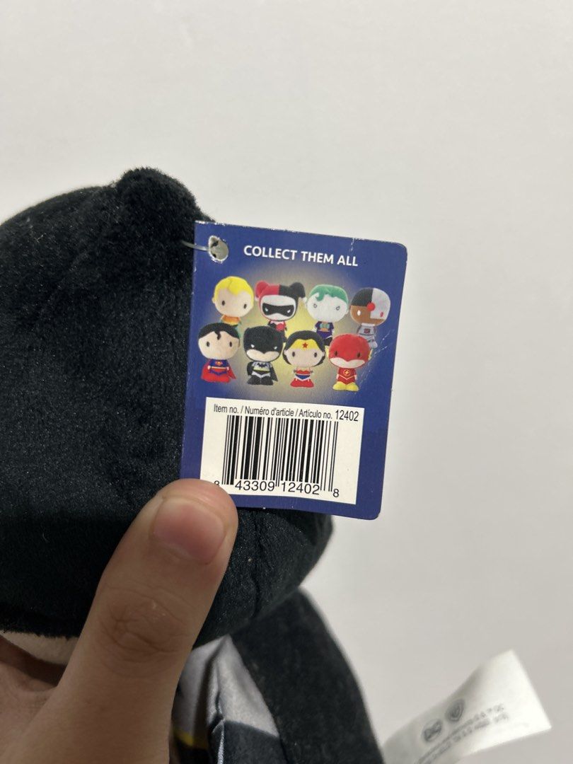 DC Comics Batman Plush Toy Stuffed Doll (Category: Plushies & Soft Toys) located in Manila. Submitted by crispeepatata (Listing ID 1468821023, Image 2). Description: - Authentic DC Comics Batman plush stuffed doll - Features classic suit, fabric cape, and yellow utility belt - Original hang tag intact (Item #12402 with collection lineup on back) - Perfect collectible piece for Batman fans of all ages.
