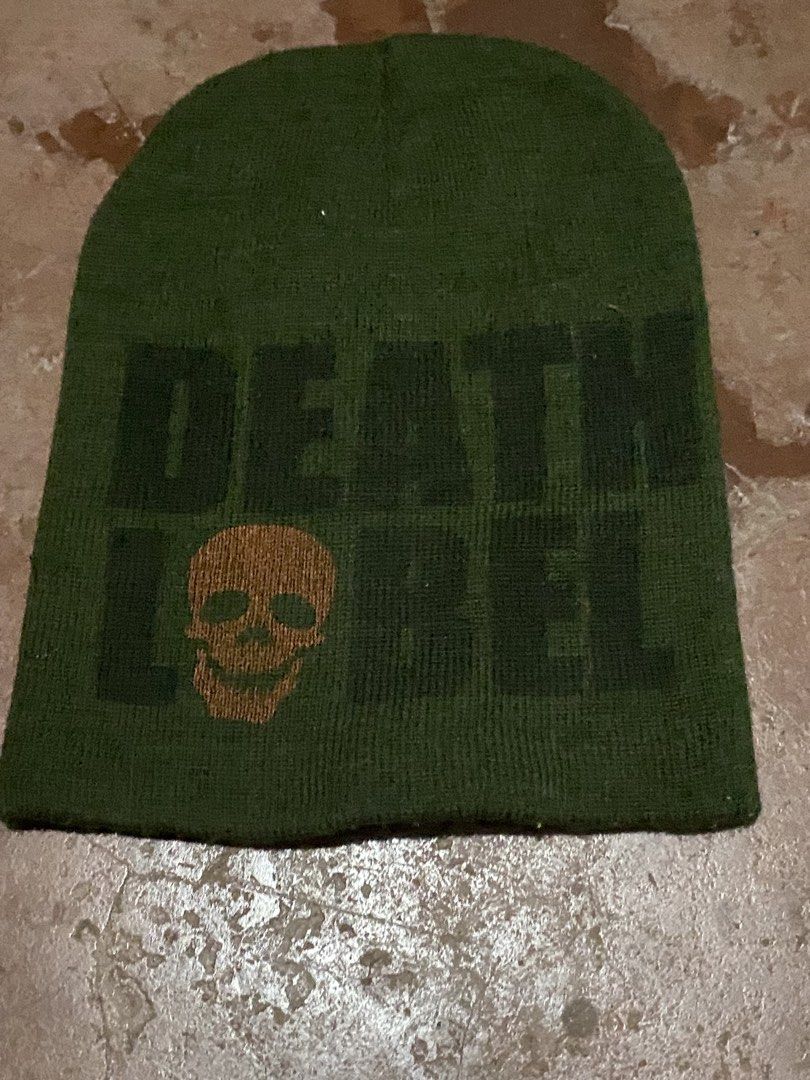 Death Label Skull Green Beanie (Category: Beanies) located in Davao. Submitted by singkorayk15407 (Listing ID 1468907259, Image 2). Description: - Color: Green - Brand: Death Label - Design: Brown skull graphic printed on the front - Style: Warm winter cap with a slouchy fit - Use: Perfect streetwear or snowboarding accessory - Condition: Excellent / Well-maintained.