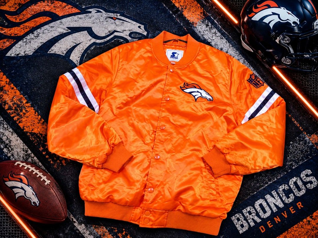 Denver Broncos Starter Orange Satin Jacket (Category: Coats, Jackets and Outerwear) located in Pandi. Submitted by yanyan_apparel.store08 (Listing ID 1468893352, Image 1). Description: - Official Starter Denver Broncos bright orange jacket - Silky satin material inside and out for a smooth feel - Button-up front with secure snap closures - Classic team logo on the chest and NFL patch on the sleeve - Striped ribbed cuffs and hem for a snug fit - E