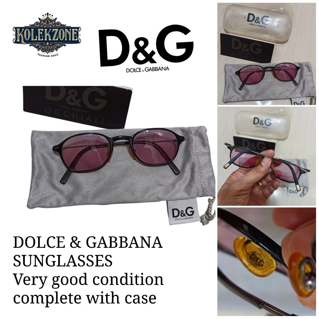 D&G Dolce & Gabbana Sunglasses with Case (Category: Sunglasses & Eyewear) located in Nasugbu. Submitted by staffpicks1515 (Listing ID 1468787885, Image 1). Description: - Brand: Authentic Dolce & Gabbana (D&G) - Design: Dark frames with trendy pink tinted lenses - Details: Signature D&G logo on amber nose pads - Inclusions: Original clear plastic hard case, branded box, and grey drawstring pouch - Condition: Solid, durable frames with minimal wea