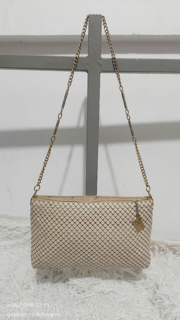 DIANA METAL MESH BAG (Category: Shoulder Bags) located in Kalibo. Submitted by secondchances.thriftsh8p (Listing ID 1468890715, Image 2). Description: - Brand: Diana - Color: Cream with gold-toned hardware - Material: Mesh body with textured metallic tile pattern - Strap: Gold-toned chain with segmented metal links - Closure: Top zipper with a 'symbol of quality' hanging metal tag - Interior: Fully fabric-lined - Size: Compact and easy to sling f
