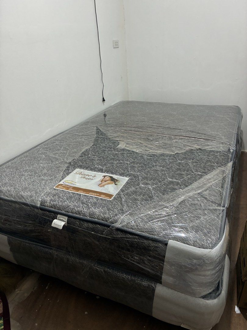 Diane's Design by Dewfoam Mattress (Category: Bed Frames & Mattresses) located in Manila. Submitted by reese1230 (Listing ID 1468799014, Image 1). Description: - Brand: Dewfoam (Diane's Design) - Set: Includes both mattress and base - Condition: still in original plastic protective covering with label attached - Design: Dark grey upholstery with a stylish textured geometric pattern - Perfect for upgrading your bedroom with comfort and modern styl