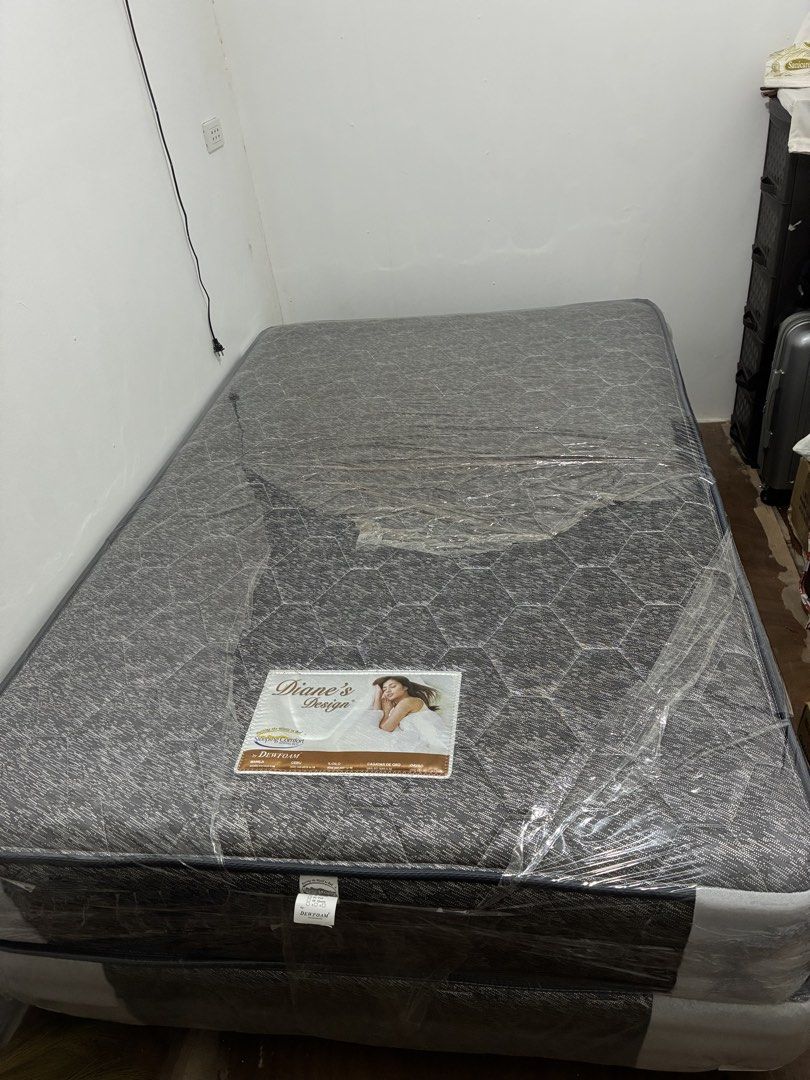 Diane's Design by Dewfoam Mattress (Category: Bed Frames & Mattresses) located in Manila. Submitted by reese1230 (Listing ID 1468799014, Image 2). Description: - Brand: Dewfoam (Diane's Design) - Set: Includes both mattress and base - Condition: still in original plastic protective covering with label attached - Design: Dark grey upholstery with a stylish textured geometric pattern - Perfect for upgrading your bedroom with comfort and modern styl