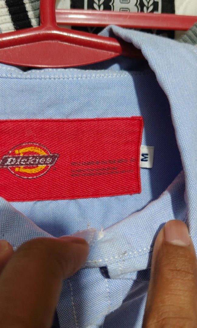 Dickies Long Sleeve Button Down Shirt Light Blue (Category: Tshirts & Polo Shirts ) located in Bulacan. Submitted by adrian2325 (Listing ID 1468784084, Image 2). Description: - Brand: Dickies - Color: Light blue - Style: Long sleeve button-down shirt with classic collar - Details: Single chest pocket with iconic Dickies patch logo and small red tag near the hem - Versatility: Perfect and easy to style for casual days or work wear.