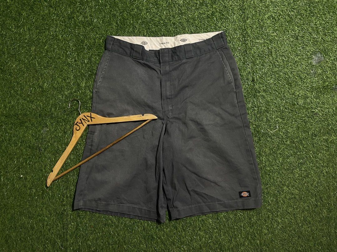 Dickies Loose Fit Grey Work Shorts (Category: Shorts) located in Las Pinas. Submitted by jynxdefant26140 (Listing ID 1468899779, Image 1). Description: - Brand: Dickies - Color: Grey - Style: Loose fit work shorts / Streetwear staple - Material: Sturdy and durable twill fabric - Pockets: Classic four-pocket design plus a functional left-leg tool pocket - Details: Branded Dickies logo patch on the back pocket and cool printed interior waistband li