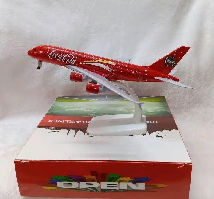 Diecast Airplane Model DHL Livery with Display Stand (Category: Vehicle & Diecast Models) located in Manila. Submitted by iliasjen3082126 (Listing ID 1468865490, Image 2). Description: - Official DHL delivery livery diecast airplane model - Vibrant yellow body with signature red branding on side and tail - Solid and sturdy build quality for lasting durability - Includes a white plastic display stand and matching blue box - Perfect collectible pie