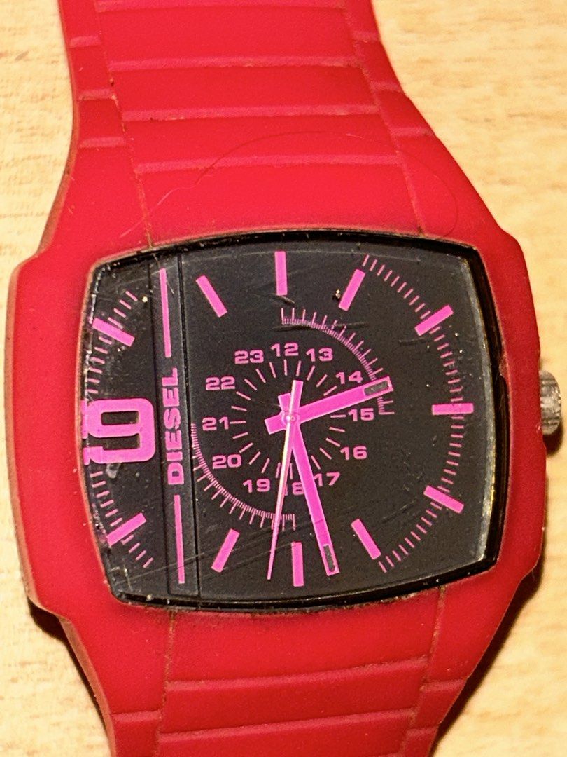 Diesel Trojan DZ1351 (Category: Women's Watches) located in Manila. Submitted by _zzaney (Listing ID 1468851999, Image 3). Description: - Brand/Model:Diesel “Trojan” Young Blood Red watch (Model: DZ1351) - Design: Bright red silicone strap and case with a bold black square dial - color: Bright pink sa personal - Accents: Eye-catching pink hour markers, hands, and large number 9 - Features: 24-hour inner track and stainless steel case back - Closu