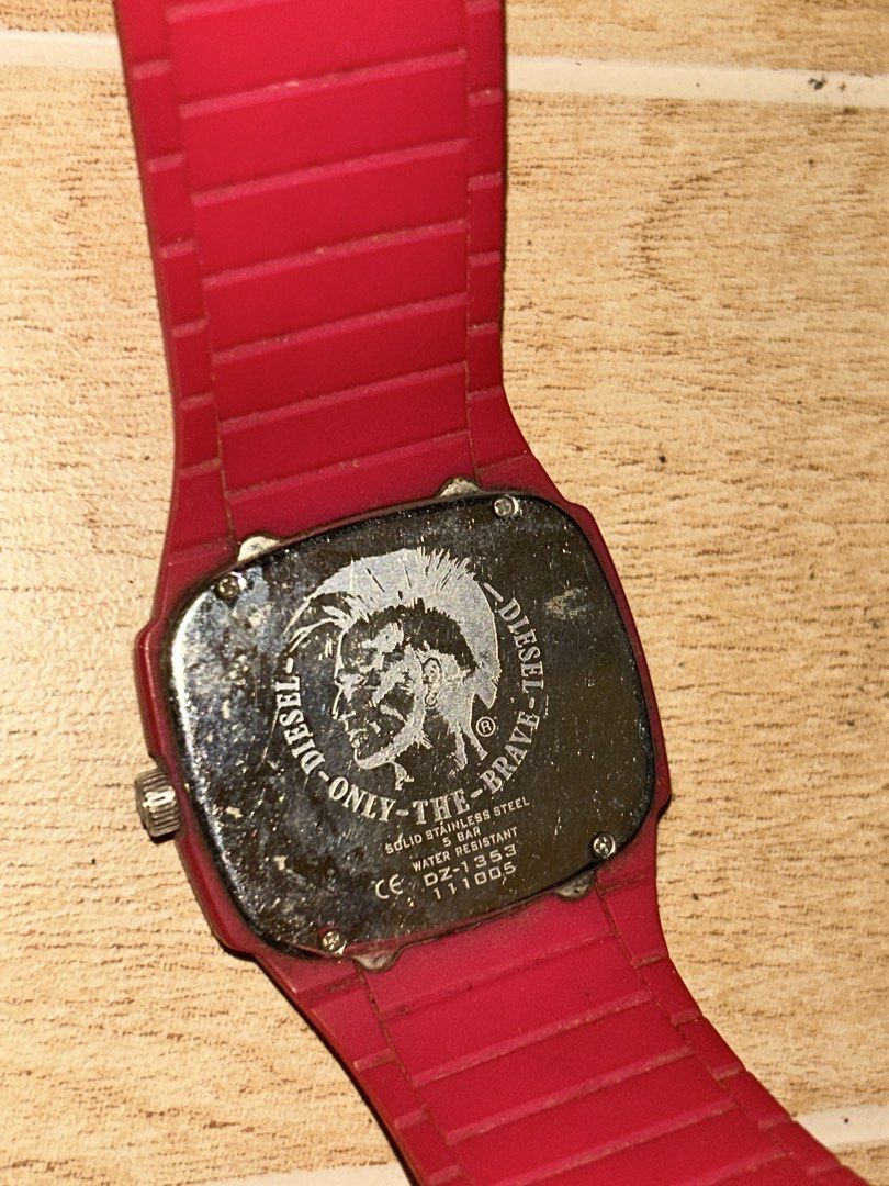 Diesel Trojan DZ1351 (Category: Women's Watches) located in Manila. Submitted by _zzaney (Listing ID 1468851999, Image 2). Description: - Brand/Model:Diesel “Trojan” Young Blood Red watch (Model: DZ1351) - Design: Bright red silicone strap and case with a bold black square dial - color: Bright pink sa personal - Accents: Eye-catching pink hour markers, hands, and large number 9 - Features: 24-hour inner track and stainless steel case back - Closu
