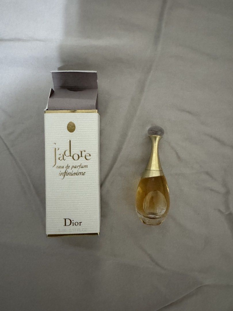 Dior J'adore Eau de Parfum Infinissime 5ml Mini (Category: Fragrance & Deodorants) located in Pasig City. Submitted by jubinnnie (Listing ID 1468726712, Image 2). Description: - Authentic Dior J'adore Eau de Parfum Infinissime - Size: 5ml / 0.17 fl oz (Miniature bottle) - Condition: Brand new, unused, and full (box only opened for photos) - Inclusions: Comes with original white and gold box - Perfect for travel, purse, or testing the fragrance be